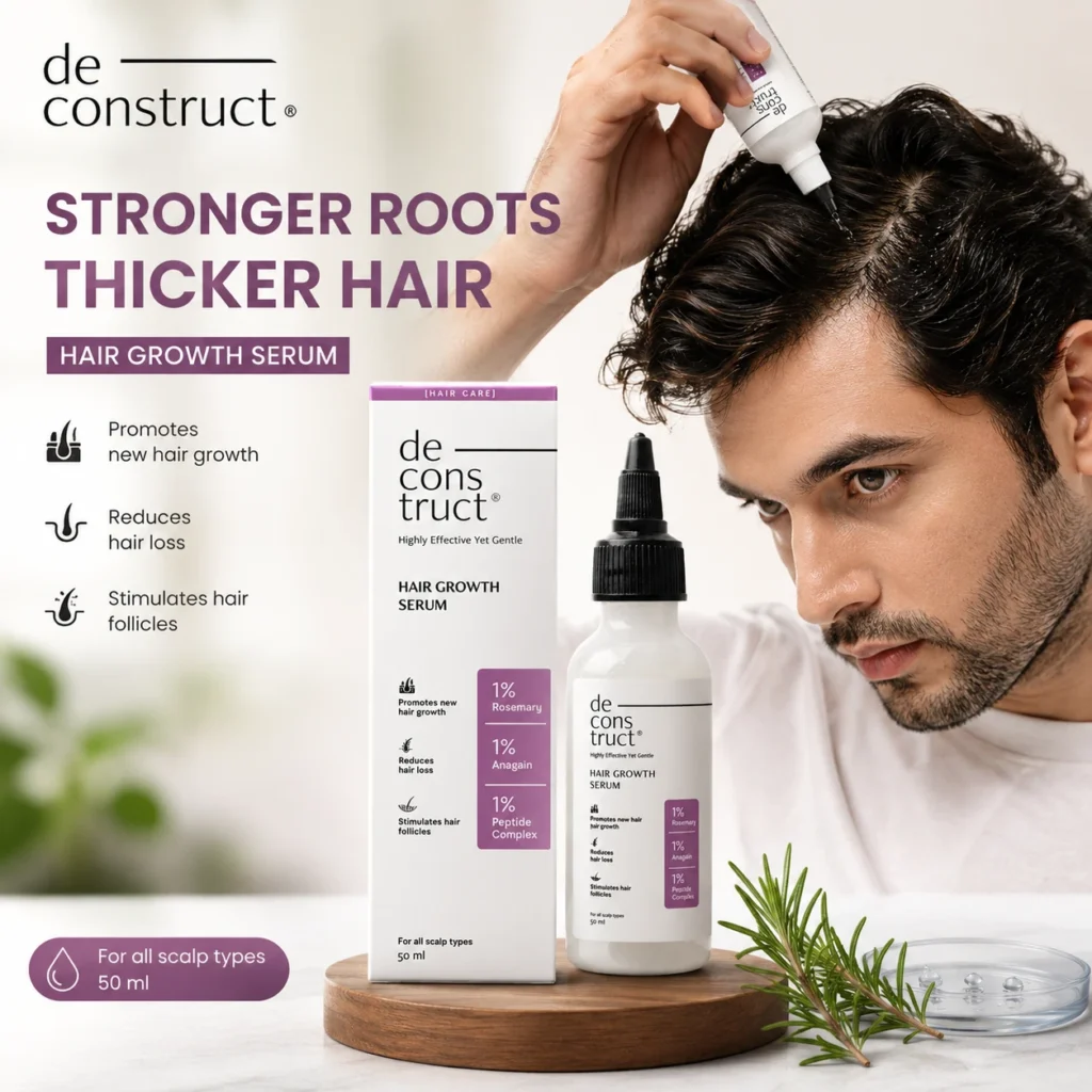 A man applying Deconstruct Hair Growth Serum on scalp with product box and bottle for stronger roots